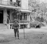 Major General Robert E. Urquhart of UK 1st Airborne Division planting the airborne flag outside his headquarters near Arnhem, the Netherlands, 22 Sep 1944