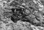 US Marine Corps machine gun crew operating a Browning M1919A4 machine gun, Namur, Marshall Islands, circa early Feb 1944