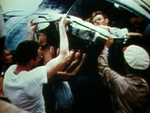 Injured US airmen being taken on a stretcher out of a PBY Catalina aircraft, Midway Atoll, 4-6 Jun 1942