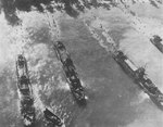 US Navy LCI(L) ships unloading men of US Army at a beach in southwestern Morotai, Dutch East Indies, 15 Sep 1944