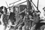 Pilots of Japanese Army 24th Squadron taking a break during the Nomonhan Incident, Mongolia Area, China, Aug 1939; the pilots were, left to right, Corporal Katsuaki Kira, Sergeant Major Chiyoji Saito (inside Toyota KC truck), Sergeant Major Hisashi Goto, Sergeant Major Koji Ishizawa, Corporal Hiroshi Sato (on truck, behind Ishizawa), and Sergeant Major Goro Nishihara