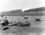 Men of the 16th Infantry Regiment, US 1st Infantry Division crossing the Weser River to attack Fürstenberg, Germany, 8 Apr 1945