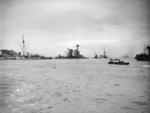 A Gooseberry line of block ships off the Normandy beaches, Ouistreham, France, Jun 1944; note sunken British ship Durban, sunken Dutch ship Sumatra, and two active DUKW craft