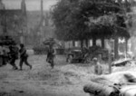 US Army soldiers seeking shelter, Saint-Lô, France, Jul 1944