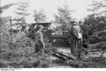 German officer and troops with a 10.5 cm K 35(t) field gun at Hornbaek, Denmark, 1940