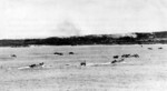 US Army troops aboard LCVP landing craft sailing toward invasion beaches on Ie Shima, Okinawa, Japan, 16 Apr 1945