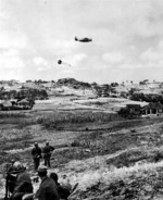 US Navy TBM-R or TBM-S Avenger aircraft dropping supplies in Korea, circa 1950-1953