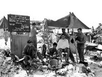 A barber shop set up by an American Marine on Peleliu, Palau Islands, 11 Oct 1944