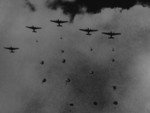 Japanese paratroopers descending on Pangkalan Benteng airfield or Pladju refineries in southern Sumatra, Dutch East Indies, 13 Feb 1942, photo 2 of 2