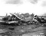 Destroyed US Army aircraft at Wheeler Field, Oahu, during post-Pearl Harbor raid clean up, Dec 1941; note P-40 parts in the pile