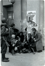 Polish family huddling before the Grand Theatre, Warsaw, Poland, Sep 1939