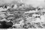 Aerial view of Warsaw, Poland, Sep 1939, photo 1 of 3; note columns of smoke from fires