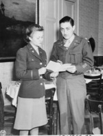 Major John Lennox and Lieutenant May Felts discussing the day