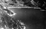 Camouflaged Japanese destroyers along the shoreline of Kurahashi Jima, Japan, 24 Jul 1945; photo taken by USS Ticonderoga aircraft