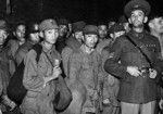 US Marines guarding a group of interned Chinese troops in the Shanghai international settlement zone, China, late 1937