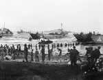 Men of the British Highland Division unloading stores on a landing beach on the opening day of the invasion of Sicily, Italy, 10 Jul 1943