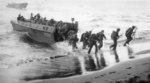 Men of US 3rd Marine Division disembarking onto the invasion beach at Bougainville, Solomon Islands, 1 Nov 1943