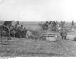 Spanish Nationalist field gun crews resting during lulls of the Battle of Guadalajara, Spain, Mar 1937