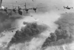 B-24 Liberator bombers of the 451st Bomb Group flying from Italy over Ploesti oil fields, Romania, May-Aug 1944. Photo 1 of 2.