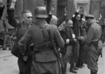 Arrested Jewish department heads of the Brauer helmet factory, Warsaw, Poland, shortly after 1700 hours on 24 Apr 1943, photo 2 of 2