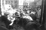 Polish resistance fighters with a captured German MG 34 machine gun on a balcony on Aleje Jerozolimskie Street, Warsaw, Poland, 27 Aug 1944