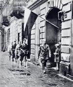 Polish resistance fighters Lieutenant Stanislaw Jankowski (foreground), Witold Abrożewicz (next in line), Kazimierz M. Piechotka, Leon Putowski, and Wojciech Bernatowicz (last in line) moments before W-hour (1700 hours) which marked the start of the Warsaw Uprising, Kazimierza Wielkiego, Warsaw, Poland, 1 Aug 1944