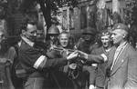 Polish resistance fighter Captain Cyprian Odorkiewicz (right) and Wacław Jastrzębowski (left) posing with captured German 5th SS Panzergrenadier Division 