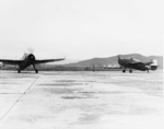 Two TBM-3 aircraft of US Navy squadron VT-26 (USS Santee) at Matsuyama Airfield, Taihoku (now Taipei), Taiwan, early Sep 1945