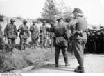 Hitler Youth members meeting soldiers of German 12th SS Panzer Division 