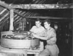 Photographers Private First Class Shemlynce and Private First Class Peter Catizone at work, Dobodura Airfield, Australian Papua, mid-1943