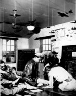 African-American US Army pilots being briefed for a practice bombing raid, Selfridge Field, Michigan, United States, 1943