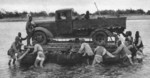 Japanese troops ferrying a truck across a river, late 1930s