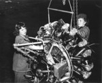 Female US Marines Private First Class Priscilla Goodrich and Private Elaine Munsinger working on an aircraft engine at Assembly and Repair Department of Marine Corps Air Station Cherry Point, Havelock, North Carolina, United States, circa 1943