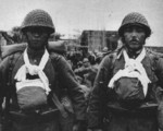 Japanese soldiers carrying the ashes of fallen comrades, China, circa late 1937 to early 1938