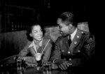 African-American US Army Sergeant Franklin Williams sharing a soda with Ellen Hardin, Baltimore, Maryland, United States, May 1942