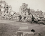 US troops fighting in a rubble strewn German town, 1944-1945