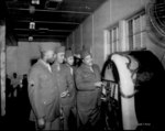 African-American US Army Private Harry Mills of the Mill Brother jazz quartet putting on a song at a jukebox, Fort Custer, Michigan, United States, 1943