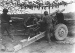 Japanese-American troops of US 442nd Regiment firing artillery to support Allied ground movements, Bruyeres Sector, France, 18 Oct 1944