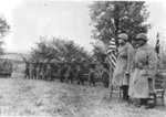 Japanese-American troops of US 442nd Regimental Combat Team firing salute in honor of fallen comrades, France, date unknown