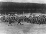 Japanese-American troops of US 442nd Regimental Combat Team marching at a review, Livorno, Italy, Sep 1945, photo 1 of 2