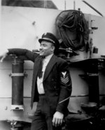 African-American sailor aboard destroyer escort Otter, circa Mar 1945