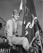 Japanese-American soldier of US 442nd Regimental Combat Team displaying the Regimental Colors featuring a Presidential Unit Citation (Truman), Honolulu, US Territory of Hawaii, 9 Aug 1946