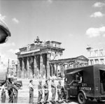 British soldiers in line for tea at NAAFI Mobile Canteen No. 750 at the Brandenburg Gate in Berlin, Germany, 16 Jul 1945