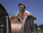 Member of a construction crew building a 33,000-volt electric power line into Fort Knox, Kentucky, United States, Jun 1942