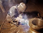 American welder making boilers for a ship, Combustion Engineering Company, Chattanooga, Tennessee, United States, Jun 1942, photo 2 of 2