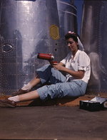 Female American factory worker taking a lunch break, Douglas Aircraft Company plant, Long Beach, California, United States, Oct 1942