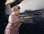 Female employee of Douglas Aircraft Company doing electrical assembly and installation work on an aircraft, Long Beach, California, United States, Oct 1942