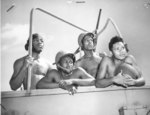 An African-American United States Coast Guard 20-mm gun crew, date unknown; left to right: D. Moore, W. Bottoms, W. Wheeler, and R. Grimes, all Steward