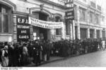 Refugees lining up outside a support center for refugees set up by the German occupation, Cherbourg, France, Jun 1940