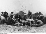 Civilians exhuming a mass grave containing victim of the Soviets, Tarnopol, Poland (now Ternopil, Ukraine), 10 Jul 1941